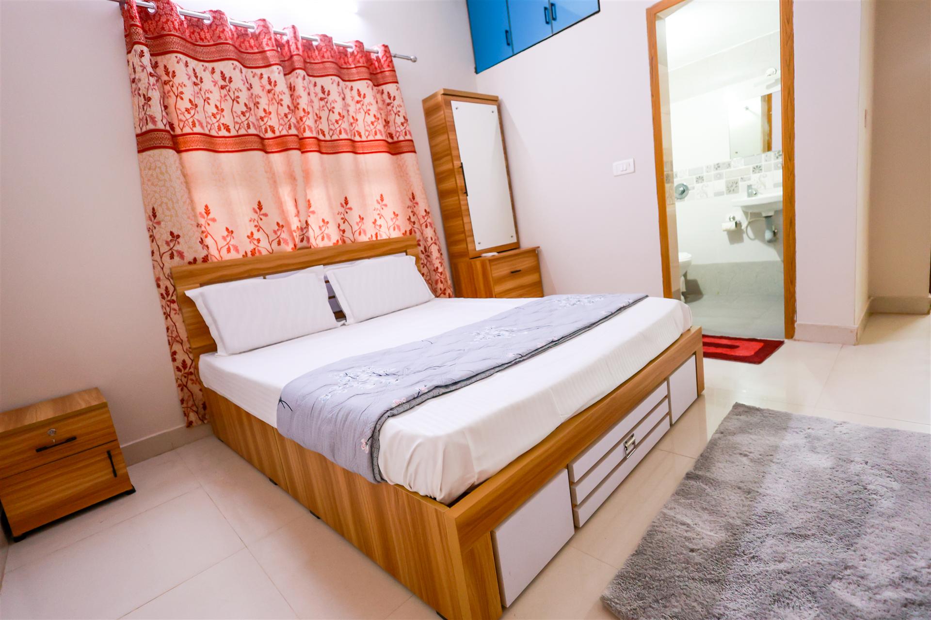 Bedroom 2 — modern double bed with attached bathroom